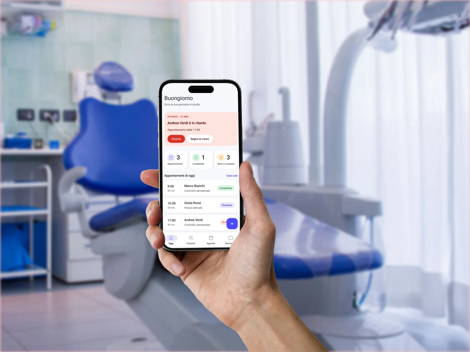 A dentist in the practice with DentPlanner open on a phone